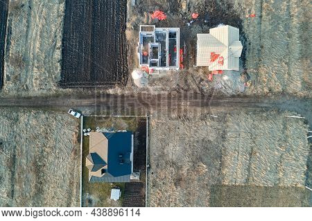 Aerial View Of Unfinished Frame Of Private House Foundation Under Construction.