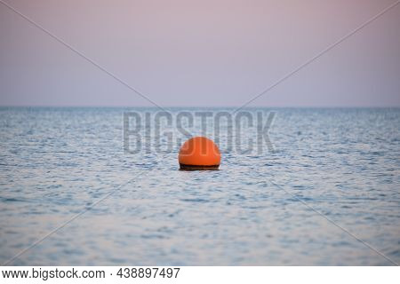 Yellow Buoy Floating On Sea Surface As Marker For Swimming Restriction In Deep Water At Tropical Res
