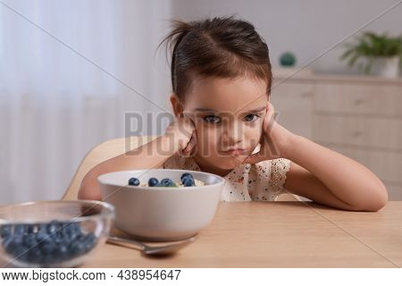 Cute Little Girl Refusing To Eat Her Breakfast At Home