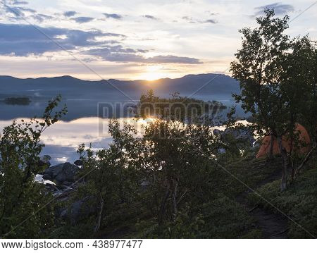 Beautiful Pink Golden Light Sunrise At Lake Dam On River Lulealven In Saltoluokta In Sweden Lapland.