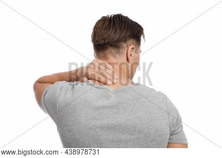 Sad Tired Millennial Caucasian Attractive Male Massaging Sore Spot And Suffering From Neck Pain