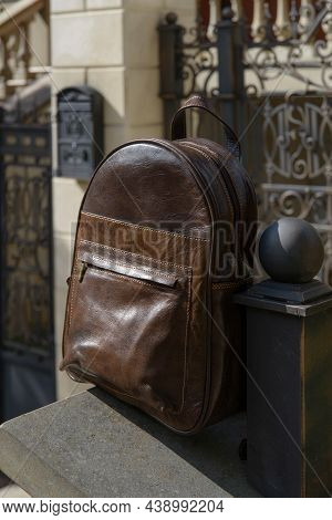 Brown Leather Backpack On The Snone Monument