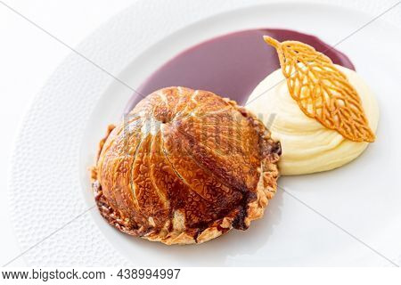 Tenderloin with pork, mushrooms and sirloin puff pastry on a white background. Homemade meal for wellington.