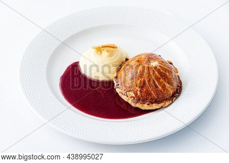 Tenderloin with pork, mushrooms and sirloin puff pastry on a white background. Homemade meal for wellington.