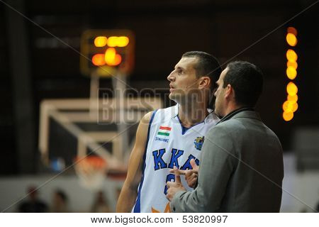KAPOSVAR, HUNGARY ÃÂ¢Ã?Ã? OCTOBER 26: Marton Fodor (in white) in action at a Hungarian Championship basketball game with Kaposvar (white) vs. Fehervar (blue) on October 26, 2013 in Kaposvar, Hungary.