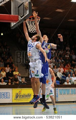 KAPOSVAR, HUNGARY ÃÂ¢Ã?Ã? OCTOBER 26: Hrvoje Puljko (in white) in action at a Hungarian Championship basketball game with Kaposvar (white) vs. Fehervar (blue) on October 26, 2013 in Kaposvar, Hungary.