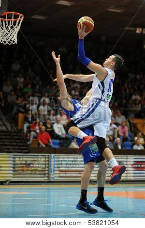 KAPOSVAR, HUNGARY ÃÂ¢Ã?Ã? OCTOBER 26: Jancsikin Branislav (in white) in action at a Hungarian Championship basketball game with Kaposvar (white) vs. Fehervar (blue) on October 26, 2013 in Kaposvar, Hungary.