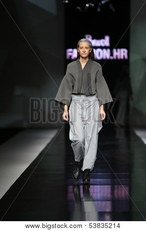 ZAGREB, CROATIA - OCTOBER 17: Fashion model wearing clothes designed by Petra Vuletic and Sasa Hortig on the 'Fashion.hr' show on October 17, 2013 in Zagreb, Croatia.