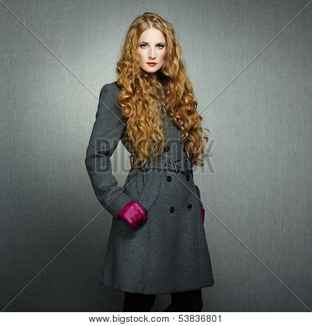 Portrait Of Young Woman In Autumn Coat