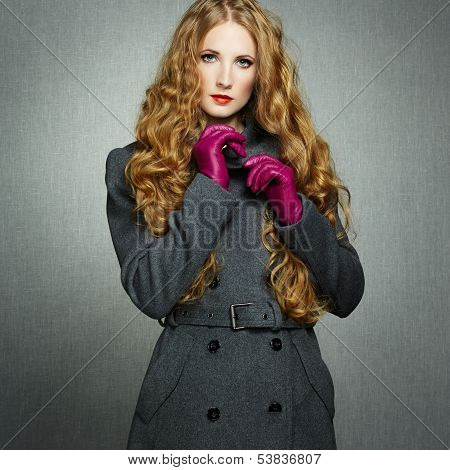 Portrait Of Young Woman In Autumn Coat