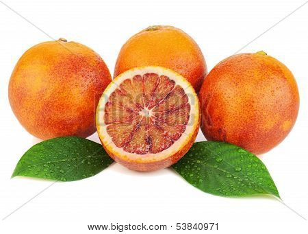 Ripe Red Blood Oranges With Cut And Green Leaves Isolated On White Background.