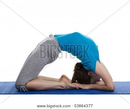 Yoga - young beautiful woman yoga instructor doing Pigeon pose asana(kapotasana) exercise isolated on white background