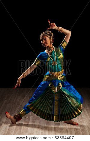 Young beautiful woman dancer exponent of Indian classical dance Bharatanatyam