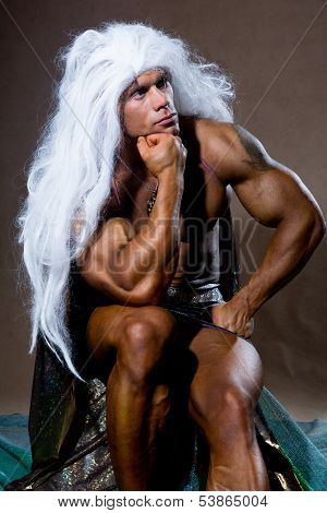 Handsome Muscular Man In A Pose Of A Thinker.