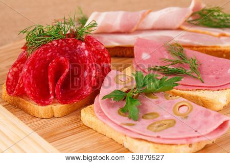 Sandwiches With Salami, Bacon And Mortadella