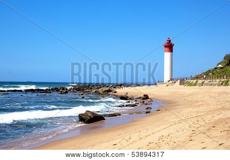 Coastal Seascape With Red And White Lighthouse