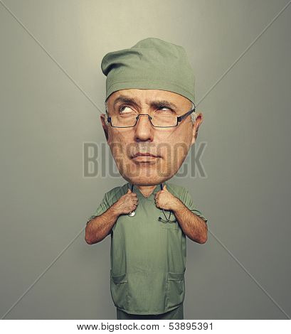 funny pensive doctor with bighead over grey background