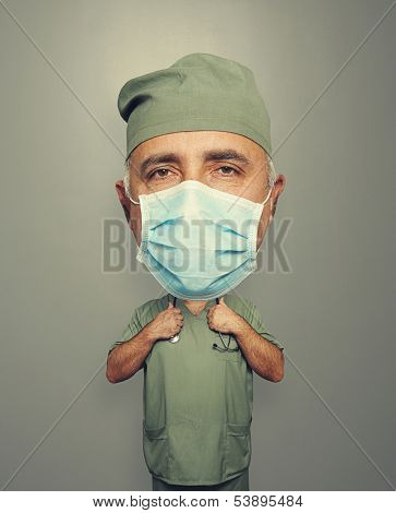 bighead doctor in mask over grey background