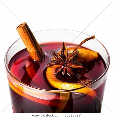 Hot Red Mulled Wine For Winter And Christmas With Orange Slice, Anise And Cinnamon Sticks Isolated O