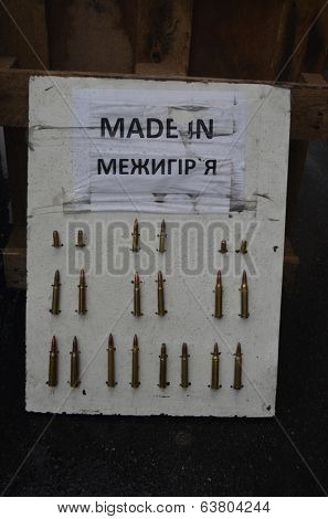 KIEV, UKRAINE - APR 19, 2014: Downtown of Kiev.Camp decoration with military items.Rioters camp.Putsch of Putsch.April 19, 2014 Kiev, Ukraine 