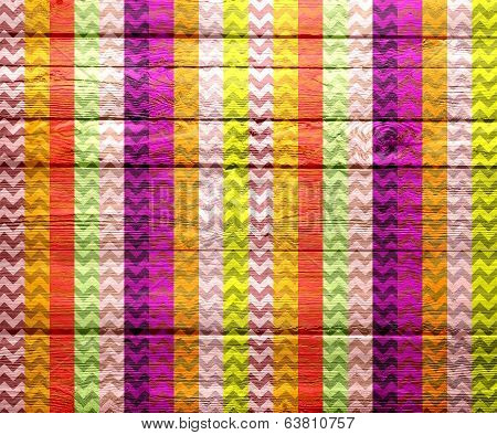 Colorful chevron pattern on wood texture