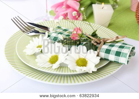 Table setting with spring flowers close up