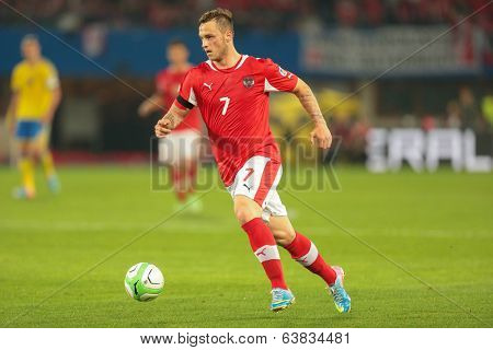 VIENNA,  AUSTRIA - JUNE  7 Marko Arnautovic (#7 Austria) runs with the ball during the world cup qualifier game on June 7, 2013 in Vienna, Austria.