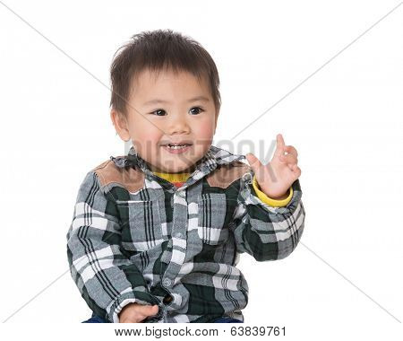 Cute baby boy rasie hand up