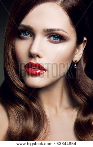 Portrait of beautiful girl with red lips.