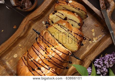 Sweet brioche bread on tray with chocolate spread 