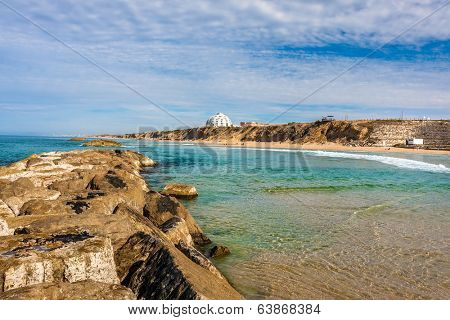 View of Mediterranean sea shoreline from breakwater in Ashkelon, Israel.