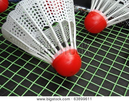 red plastic shuttlecock