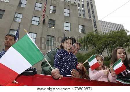 Kids on float with Italian flags