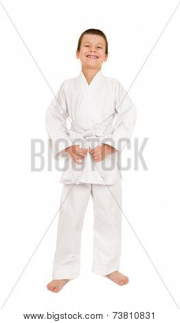 boy in white kimono for martial arts posing