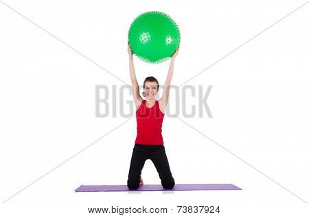 Young woman exercising with swiss ball