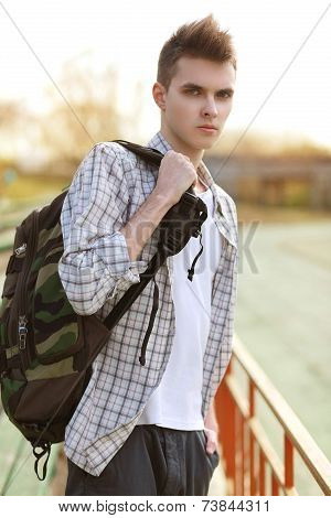 Outdoor Lifestyle Portrait Of Handsome Guy With Backpack