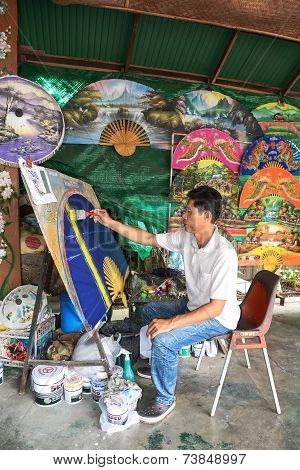 An Unidentified Man Make Paper Umbrella
