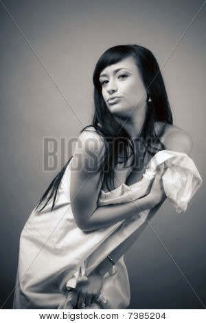 The young girl in a white bed-sheet