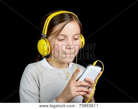 A Beautiful Young Girl Listening To Music With A Walkman