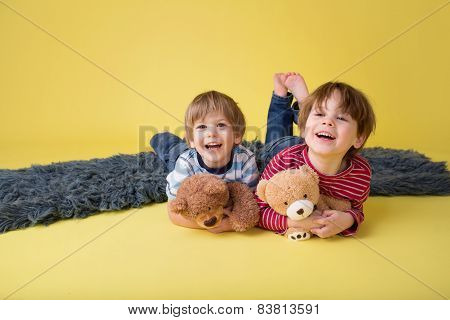Happy Kids, Siblings, Hugging Stuffed Toys
