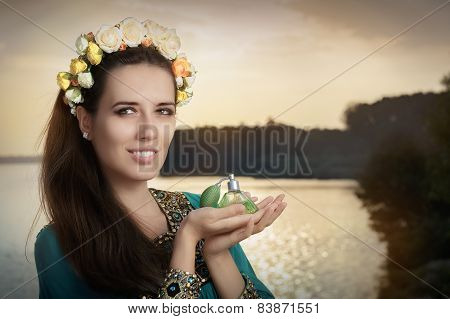 Young Woman Holding Perfume Bottle in Sunlight