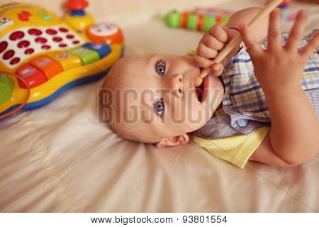 Small Kid Playing With Drum Stick