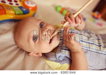 Small Kid Playing With Drum Stick