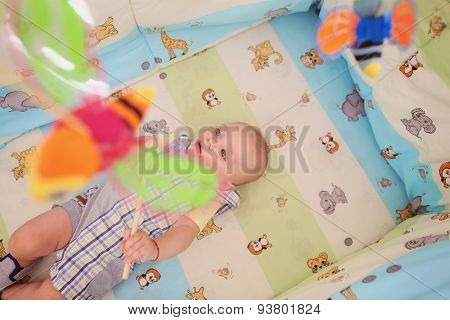Playful Kid In His Bed