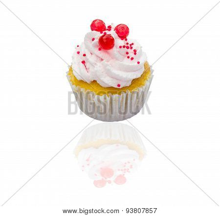 Cupcake with whipped cream and  isolated on white