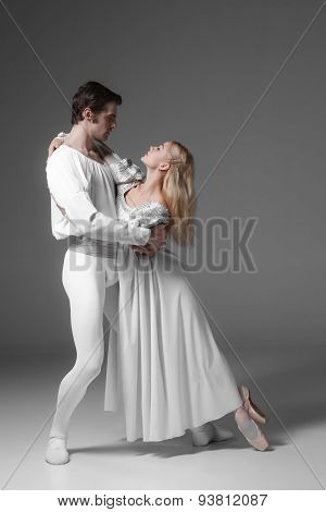 Two young ballet dancers practicing. attractive dancing performers  in white