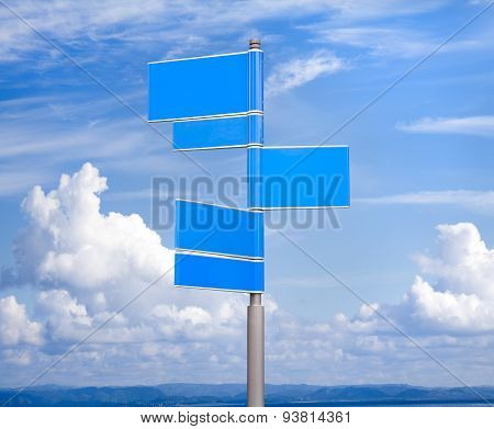Blank signs in blue color against sky