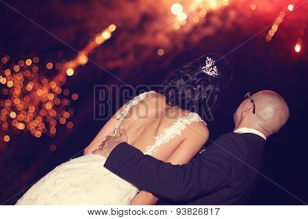 Bride And Groom Surrounded By Fire Crackers