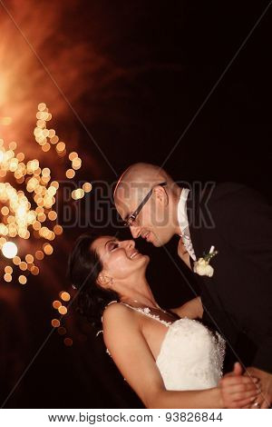 Bride And Groom Surrounded By Fire Crackers