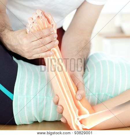 Digital composite of Highlighted bones of woman at physiotherapist